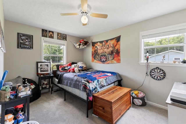 1040 Rebecca Dr, Burns, TN 37029 - bedroom with carpet floors, ceiling fan, and baseboards
