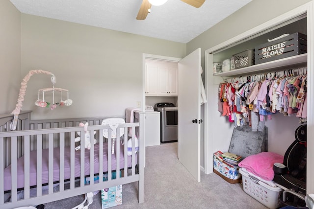 1040 Rebecca Dr, Burns, TN 37029 - bedroom featuring separate washer and dryer, light colored carpet, a crib, a ceiling fan, and a closet