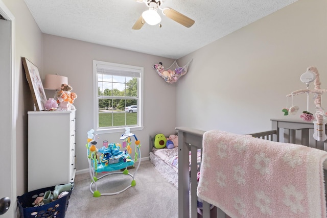 1040 Rebecca Dr, Burns, TN 37029 - bedroom with carpet floors, baseboards, a textured ceiling, and a ceiling fan