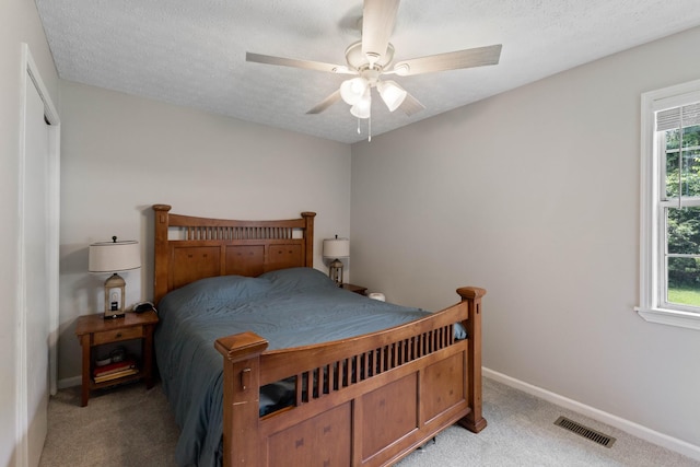 1040 Rebecca Dr, Burns, TN 37029 - bedroom with light carpet, multiple windows, and baseboards