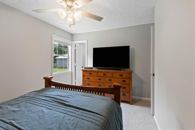1040 Rebecca Dr, Burns, TN 37029 - bedroom featuring light carpet, a textured ceiling, baseboards, and a ceiling fan