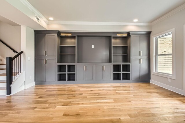 549B Stevenson St, Nashville, TN 37209 - unfurnished living room with plenty of natural light, light wood finished floors, baseboards, crown molding, and stairs