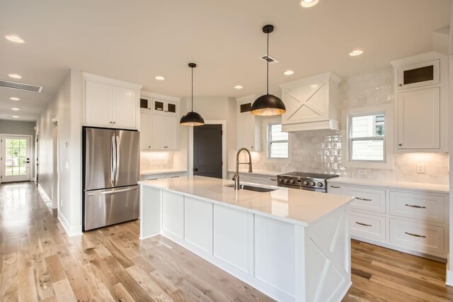 549B Stevenson St, Nashville, TN 37209 - kitchen with appliances with stainless steel finishes, a sink, white cabinets, tasteful backsplash, and recessed lighting