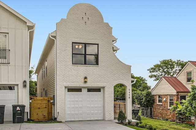 549B Stevenson St, Nashville, TN 37209 - view of front facade featuring a garage, driveway, and brick siding