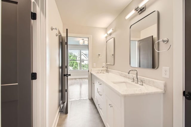 549B Stevenson St, Nashville, TN 37209 - bathroom with double vanity, baseboards, and tile patterned floors