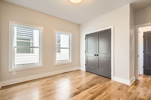 549B Stevenson St, Nashville, TN 37209 - unfurnished bedroom featuring light wood-style floors, baseboards, and a closet