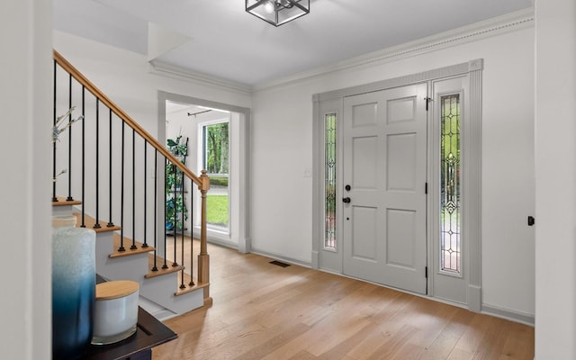 1234 Mountain Brook Cir, Signal Mountain, TN 37377 - foyer entrance featuring wood finished floors, crown molding, stairway, and baseboards