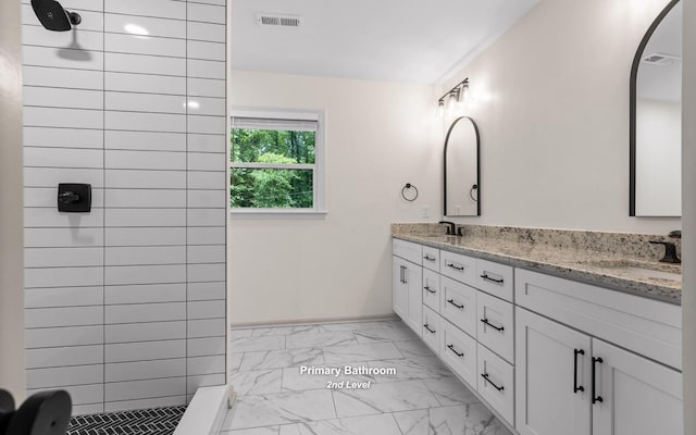 1234 Mountain Brook Cir, Signal Mountain, TN 37377 - full bathroom featuring marble look tile flooring, double vanity, tiled shower, and baseboards