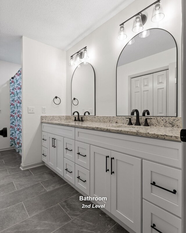 1234 Mountain Brook Cir, Signal Mountain, TN 37377 - full bath featuring double vanity, a textured ceiling, and baseboards
