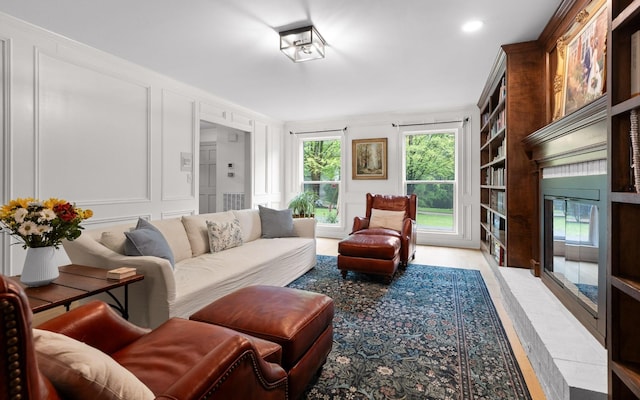 1234 Mountain Brook Cir, Signal Mountain, TN 37377 - living area with a decorative wall, ornamental molding, and light wood-style floors