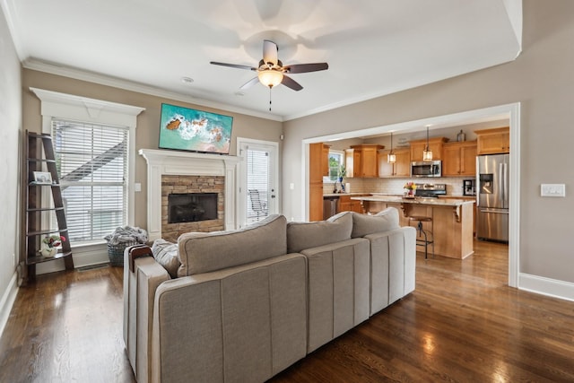 300 Dutchfalls Cv, Hermitage, TN 37076 - living room featuring baseboards, a ceiling fan, plenty of natural light, and crown molding