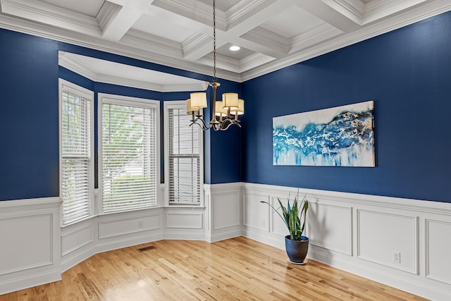 849 Graysville Rd, Chattanooga, TN 37421 - empty room featuring a chandelier, beam ceiling, coffered ceiling, light wood-style flooring, and ornamental molding