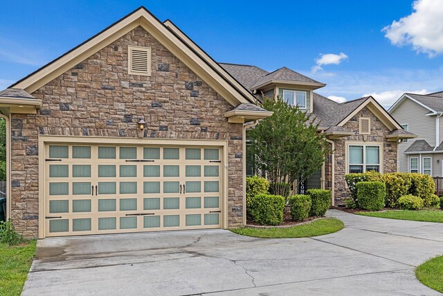 849 Graysville Rd, Chattanooga, TN 37421 - view of front of property featuring stone siding, concrete driveway, and an attached garage