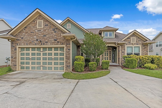 849 Graysville Rd, Chattanooga, TN 37421 - view of front of house with stone siding, concrete driveway, a garage, and a shingled roof