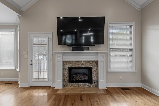 849 Graysville Rd, Chattanooga, TN 37421 - unfurnished living room featuring crown molding, vaulted ceiling, wood finished floors, a fireplace, and baseboards