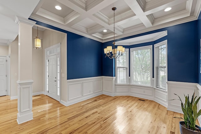 849 Graysville Rd, Chattanooga, TN 37421 - unfurnished dining area with beamed ceiling, light wood-style flooring, crown molding, a wainscoted wall, and ornate columns