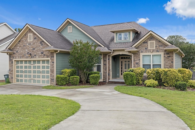 849 Graysville Rd, Chattanooga, TN 37421 - craftsman inspired home with stone siding, concrete driveway, a front lawn, and a garage