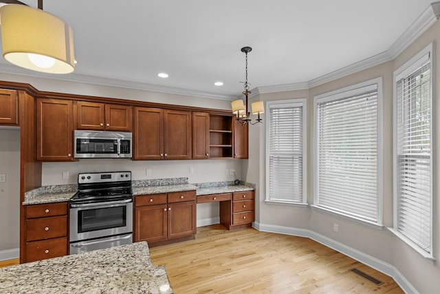 849 Graysville Rd, Chattanooga, TN 37421 - kitchen featuring appliances with stainless steel finishes, open shelves, light wood-style floors, a chandelier, and light stone countertops