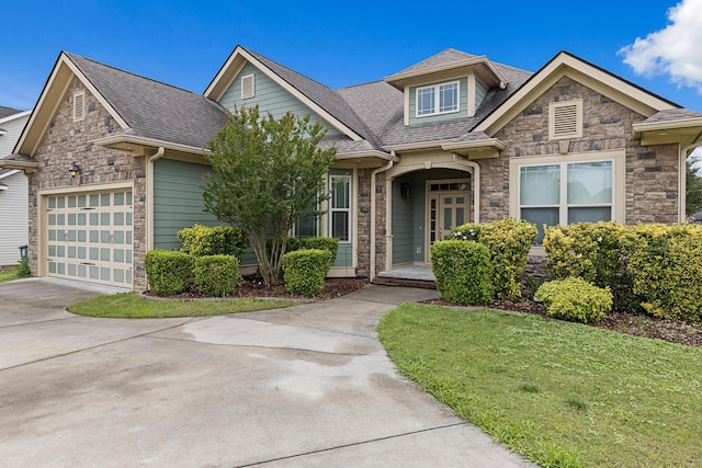 849 Graysville Rd, Chattanooga, TN 37421 - view of front facade with stone siding, driveway, a shingled roof, and a front lawn