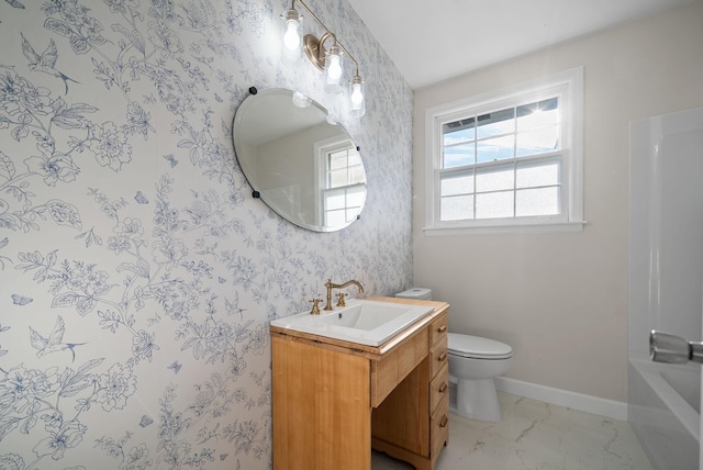 117 Robert Yoest Dr, Antioch, TN 37013 - bathroom with vanity, marble look tiles, baseboards, toilet, and bathing tub / shower combination