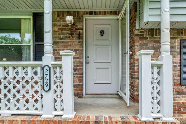 2729 Heights Circle Rd, Greenbrier, TN 37073 - entrance to property featuring covered porch and brick siding