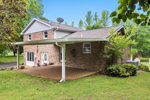 2729 Heights Circle Rd, Greenbrier, TN 37073 - rear view of property with a lawn, a patio area, central AC unit, brick siding, and roof with shingles