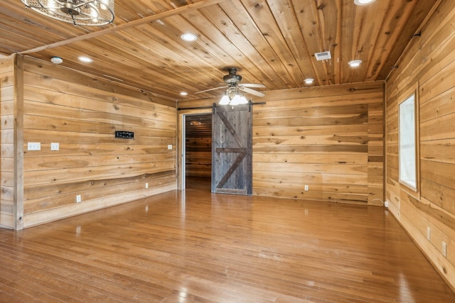 210 S 3rd St, Dickson, TN 37055 - unfurnished room with wood ceiling, wood walls, recessed lighting, hardwood / wood-style floors, and a barn door