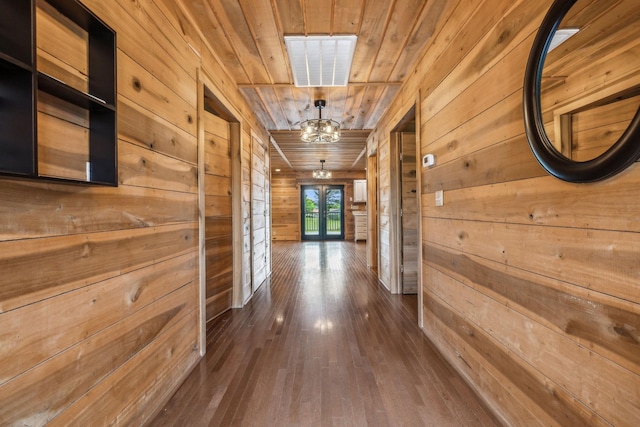 210 S 3rd St, Dickson, TN 37055 - hall with wooden walls, dark wood-style floors, wooden ceiling, and french doors