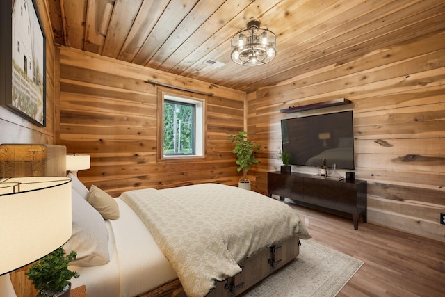 210 S 3rd St, Dickson, TN 37055 - bedroom with wood walls, wood ceiling, wood finished floors, and a chandelier