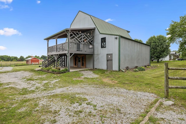 210 S 3rd St, Dickson, TN 37055 - rear view of property featuring an outbuilding, a deck, and metal roof