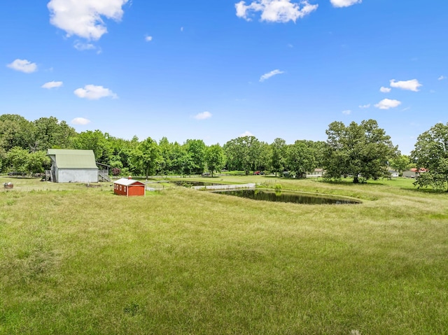 210 S 3rd St, Dickson, TN 37055 - view of grassy yard with a water view and an outdoor structure