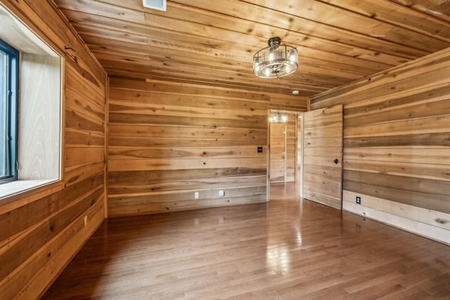 210 S 3rd St, Dickson, TN 37055 - empty room featuring a sauna / steam room, wooden ceiling, wood walls, and wood finished floors