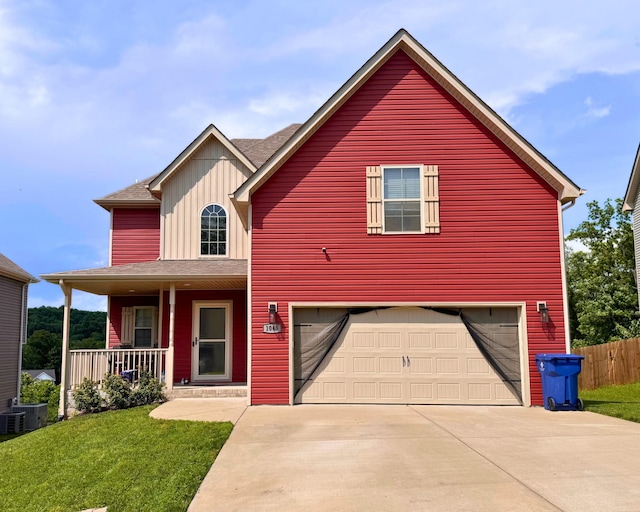 1045 Winesap Rd, Clarksville, TN 37040 - view of front of property featuring concrete driveway, a porch, a garage, a shingled roof, and board and batten siding