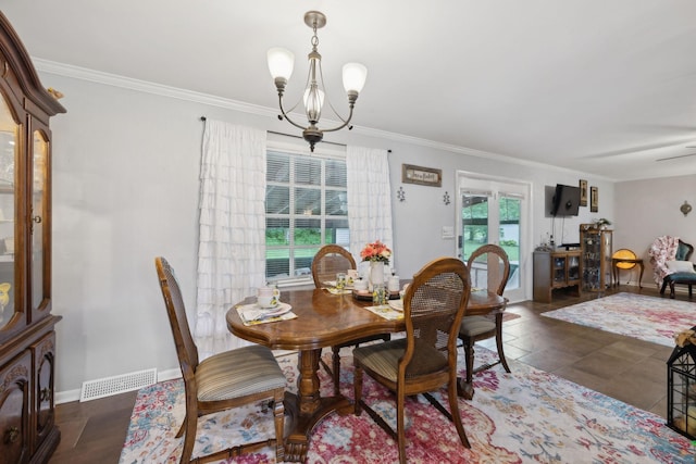 1106 5th Ave, Lawrenceburg, TN 38464 - dining area featuring a chandelier, ornamental molding, and baseboards