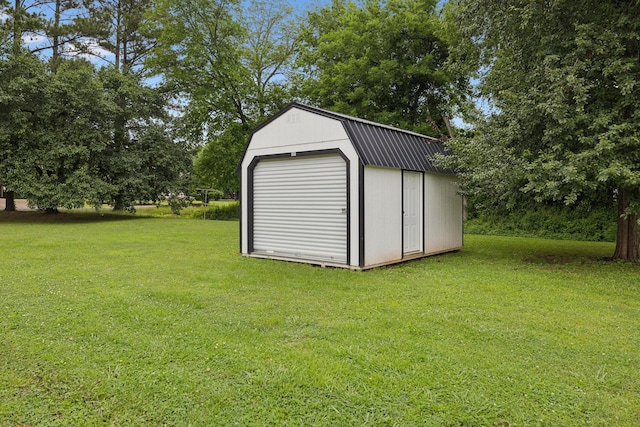 1106 5th Ave, Lawrenceburg, TN 38464 - garage featuring a storage shed