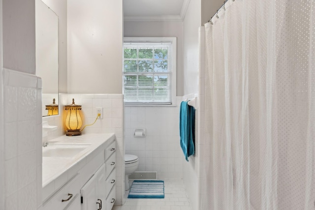 1106 5th Ave, Lawrenceburg, TN 38464 - bathroom featuring vanity, toilet, tile walls, crown molding, and wainscoting