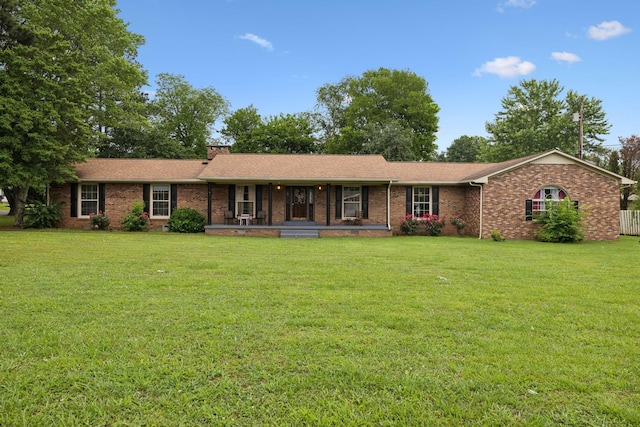 1106 5th Ave, Lawrenceburg, TN 38464 - ranch-style house with a front yard, covered porch, brick siding, a chimney, and roof with shingles