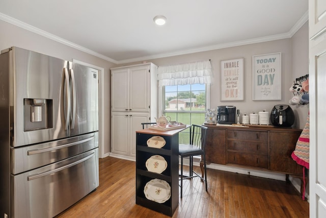 1106 5th Ave, Lawrenceburg, TN 38464 - kitchen with stainless steel fridge, crown molding, white cabinets, light wood-style flooring, and an office area