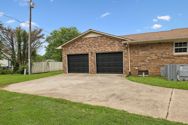 1106 5th Ave, Lawrenceburg, TN 38464 - view of home's exterior featuring cooling unit, brick siding, concrete driveway, an attached garage, and a shingled roof