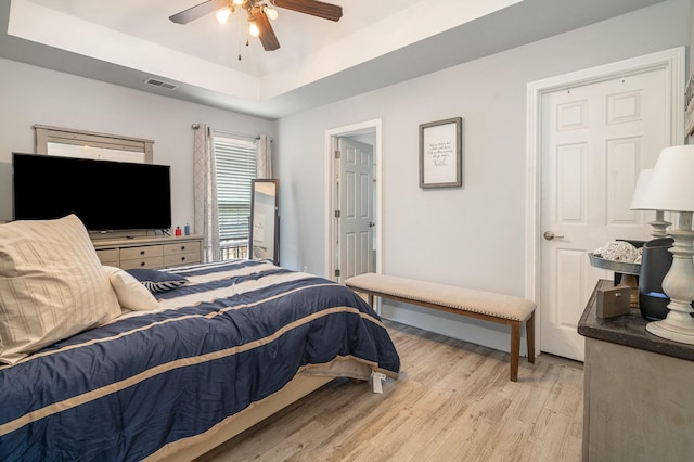 409 Princeton Dr, Lebanon, TN 37087 - bedroom with a tray ceiling, light wood-style flooring, and a ceiling fan