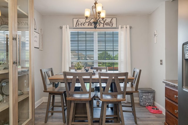 409 Princeton Dr, Lebanon, TN 37087 - dining space featuring dark wood-type flooring, a chandelier, and baseboards