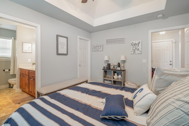409 Princeton Dr, Lebanon, TN 37087 - bedroom featuring ensuite bathroom, baseboards, a tray ceiling, and ceiling fan