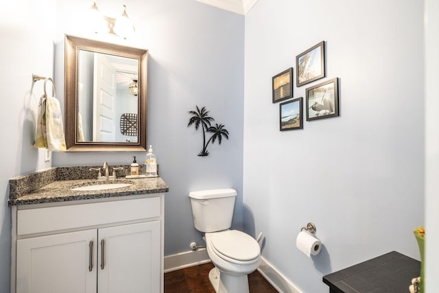 1039 Laffite Way, Gallatin, TN 37066 - bathroom with baseboards, toilet, vanity, wood finished floors, and ornamental molding