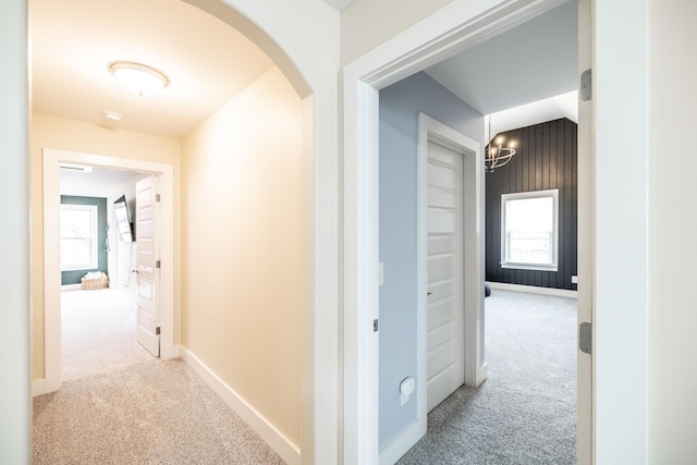 1039 Laffite Way, Gallatin, TN 37066 - corridor with carpet, arched walkways, a chandelier, and baseboards