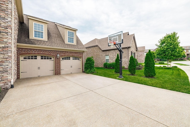 1039 Laffite Way, Gallatin, TN 37066 - view of front of property featuring a front yard, concrete driveway, roof with shingles, stone siding, and brick siding