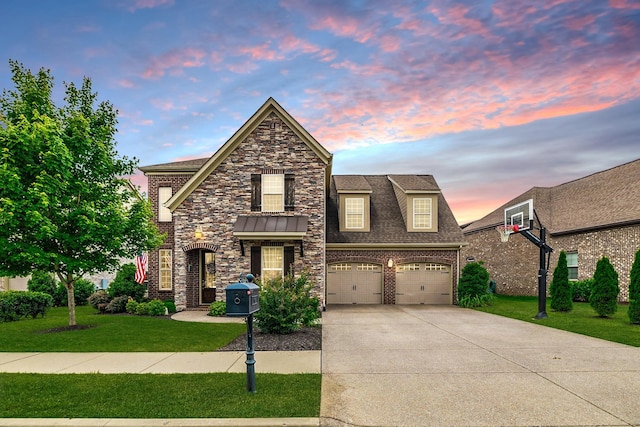 1039 Laffite Way, Gallatin, TN 37066 - traditional home with driveway, a front lawn, a garage, brick siding, and roof with shingles