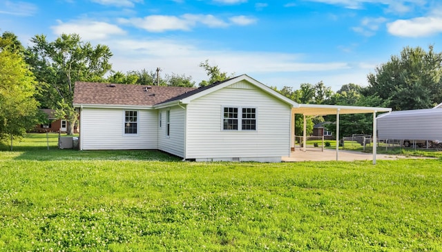 517 Overton Dr, Clarksville, TN 37042 - back of house with crawl space, a carport, and roof with shingles