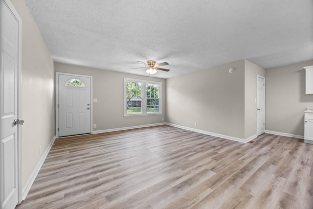517 Overton Dr, Clarksville, TN 37042 - foyer entrance with ceiling fan, a textured ceiling, light wood-style floors, and baseboards