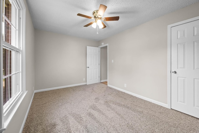 517 Overton Dr, Clarksville, TN 37042 - unfurnished bedroom with carpet, baseboards, a textured ceiling, and a ceiling fan