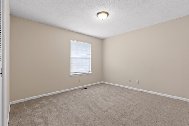 3554 Mountain Creek Rd, Chattanooga, TN 37415 - spare room featuring carpet floors, baseboards, and a textured ceiling